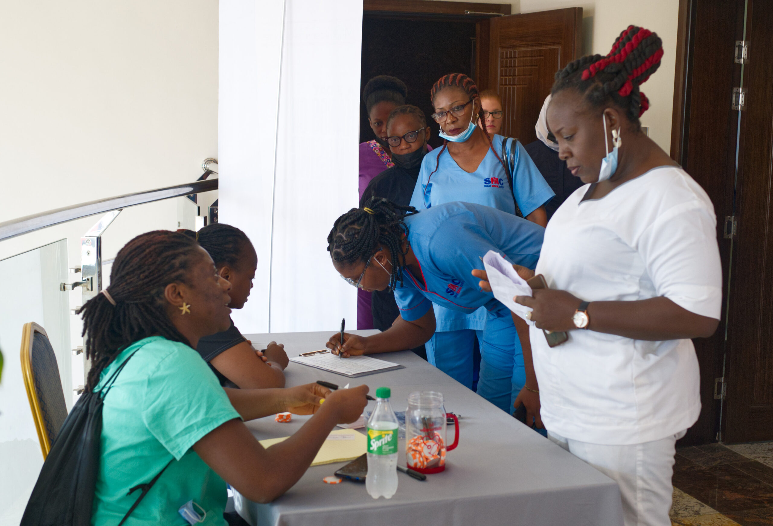 Nurse checking in at an IMO Nursing Workshop